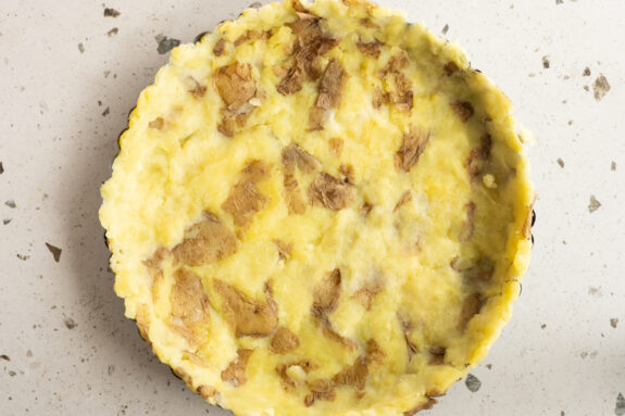 Die gekochten Kartoffeln sind in der Tarteform